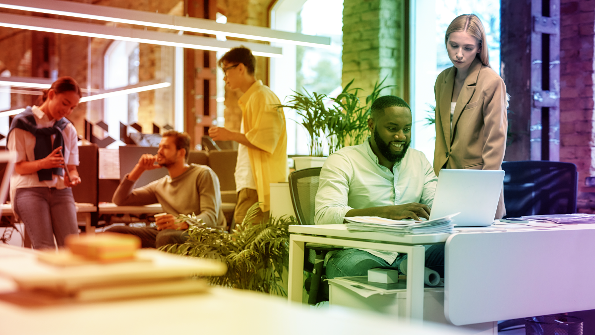 open workspace, people talking in small groups. a rainbow filter over the entire image