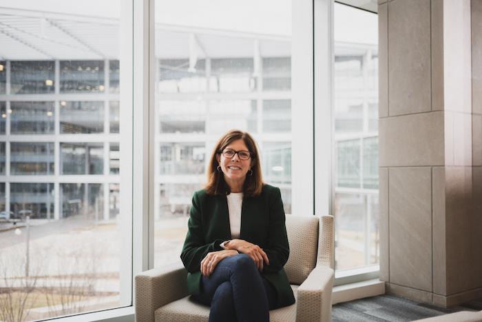 Photo of Kathy Kay seated in an office.