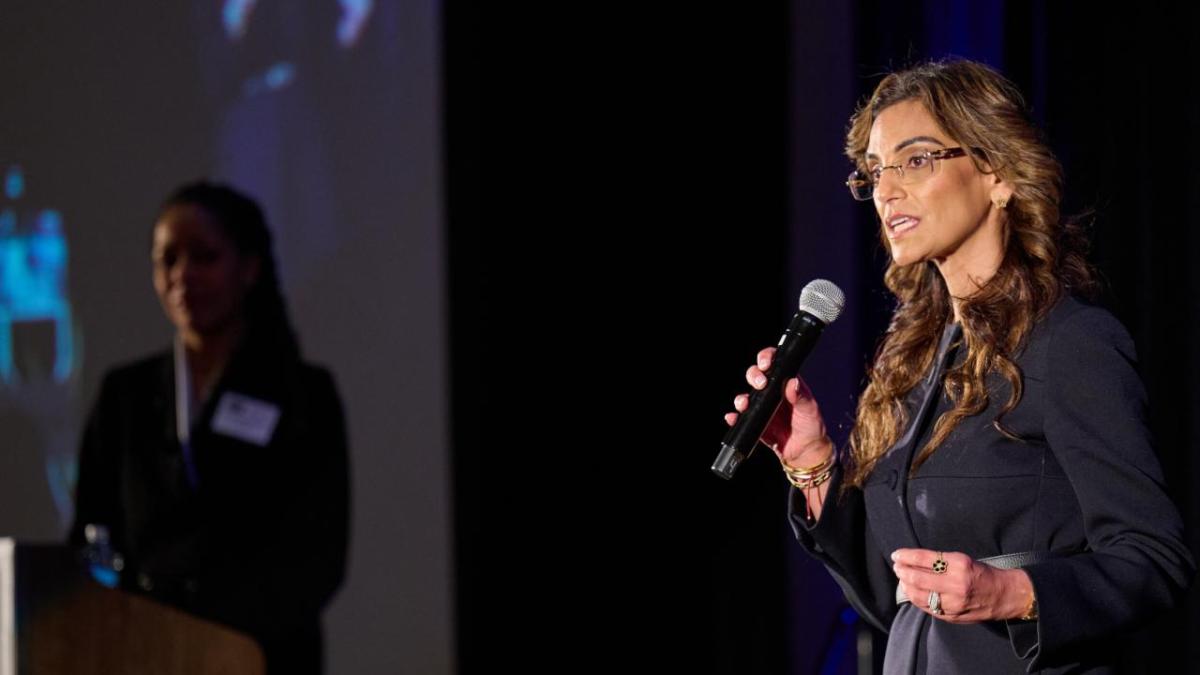 A person talking into a microphone 