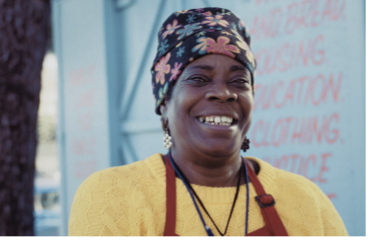 Smiling woman wearing an apron