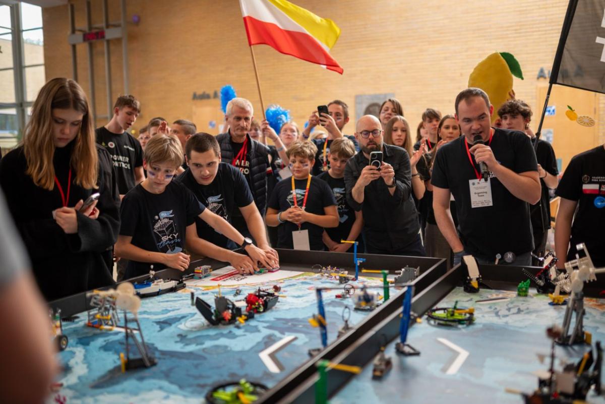 People compete at robotics league