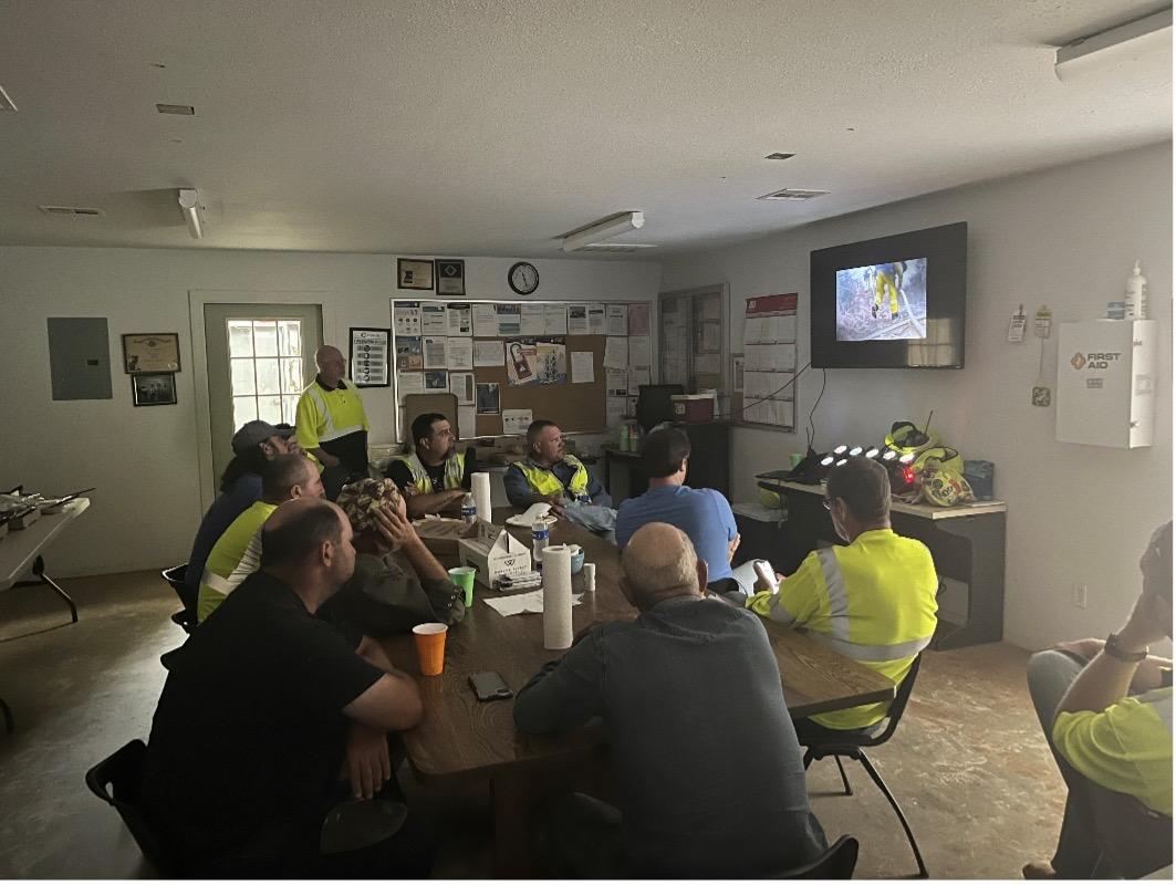 group of employees watch safety video