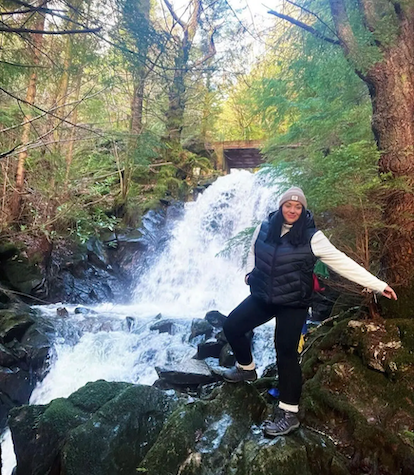 Sarah shown by a mountain stream.