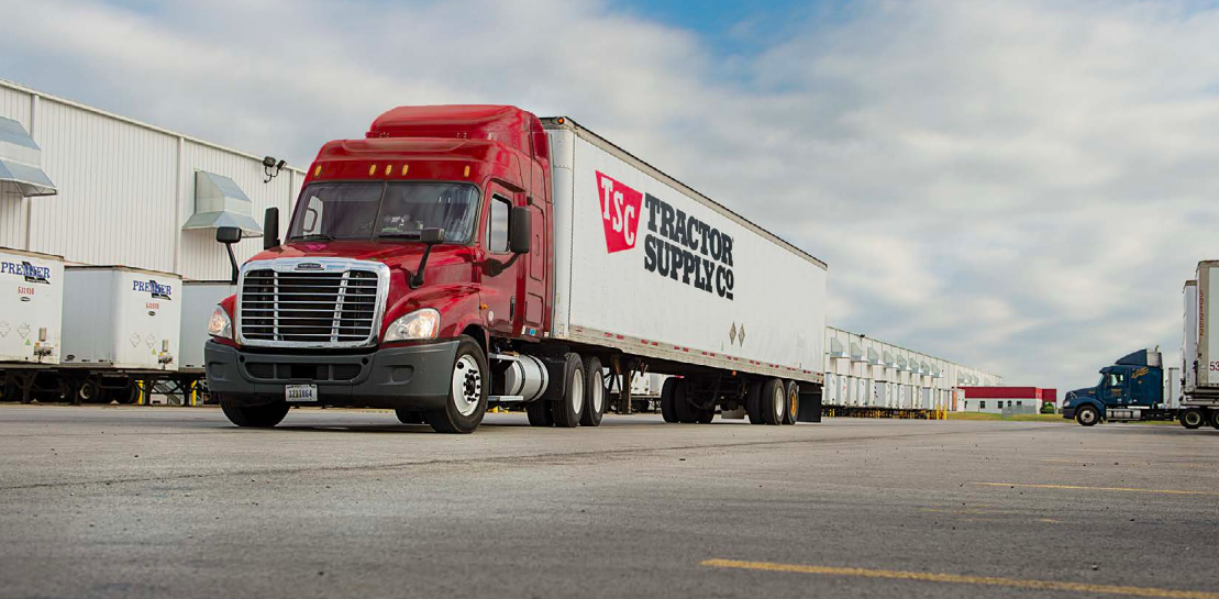 A Tractor Supply delivery truck in a parking lot