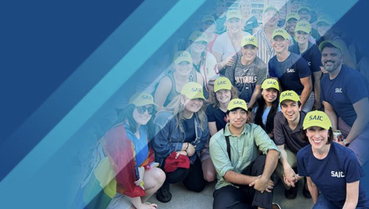 A group posed in matching hats spliced with a blue background on the left.