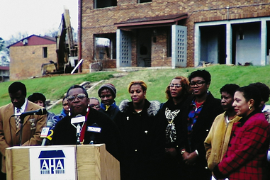 man speaking at podium