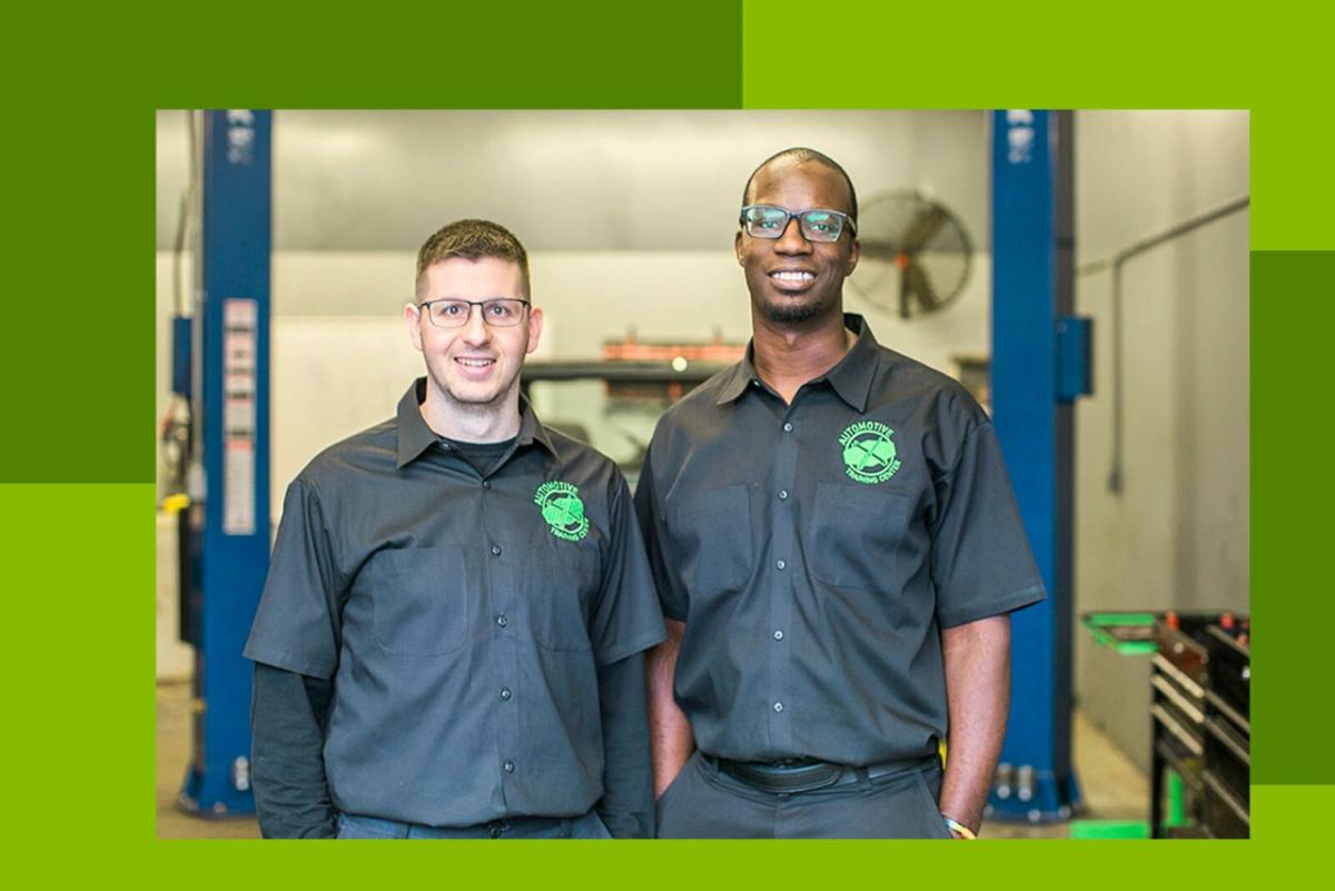 Shawn McHargue and Larry Witherspoon in mechanics uniforms