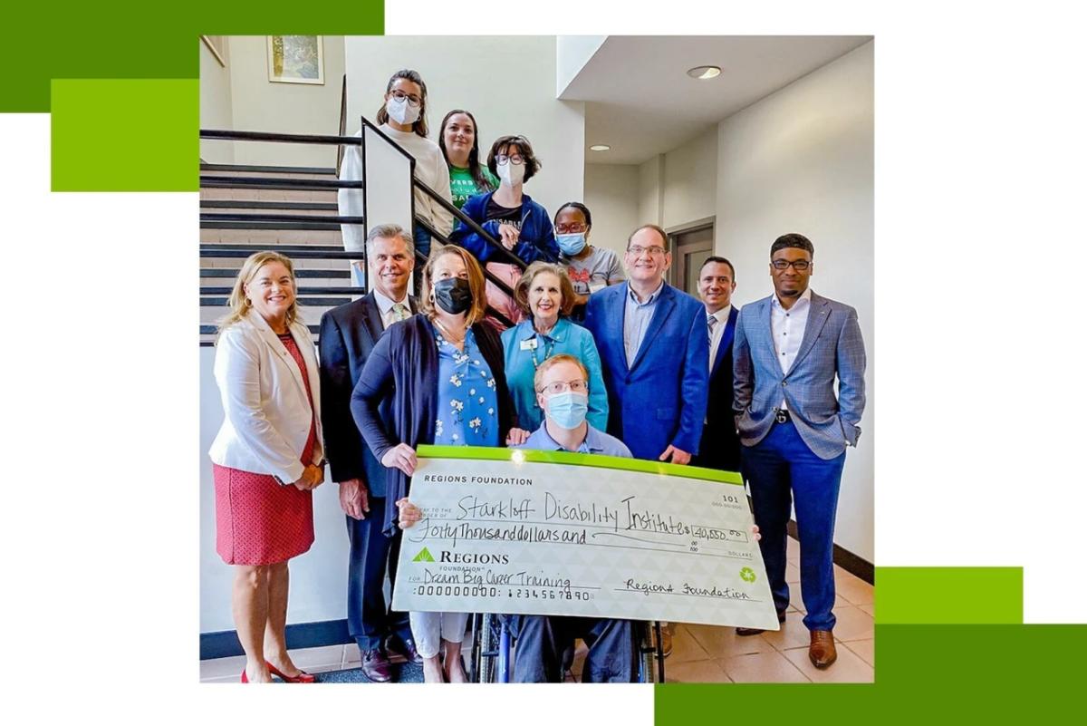 representatives of Regions Foundation and Starkloff Disability Institute pose with large check