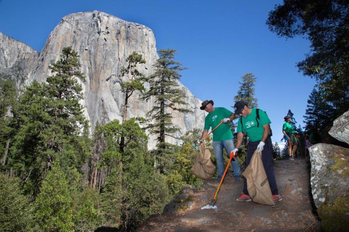 people cleaning up a trail