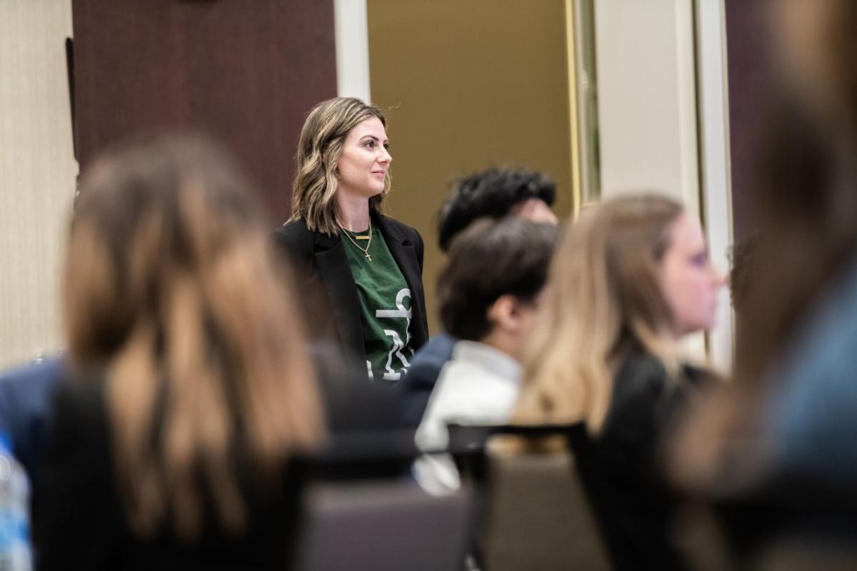 intern standing in crowd