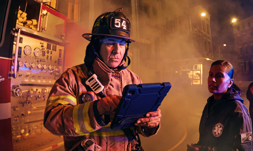 First responder holding a smart device 