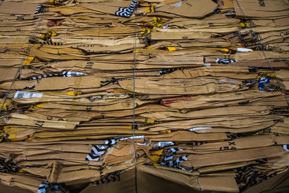 Flattened cardboard boxes at Coach's (Re)Loved and Repair workshop