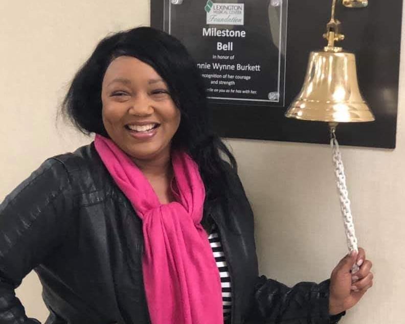 Teosha Harrison ringing the I beat cancer bell. 