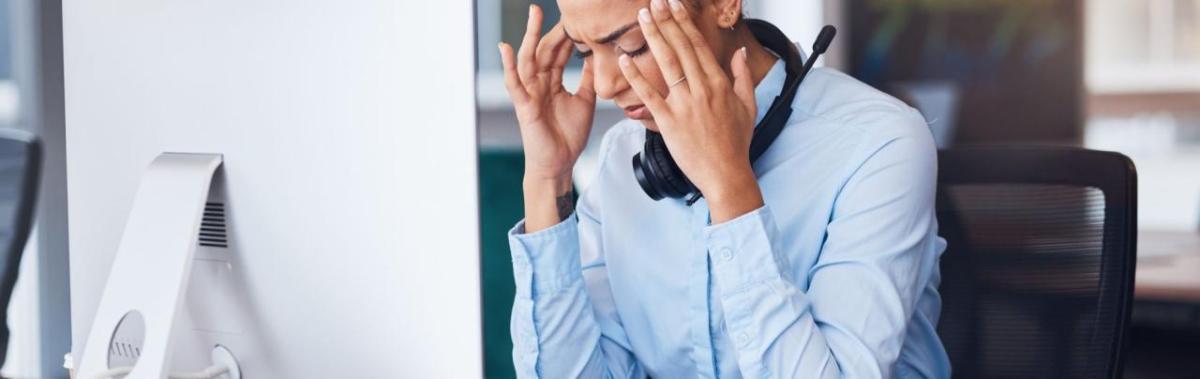 Stressed office worker in front of computer