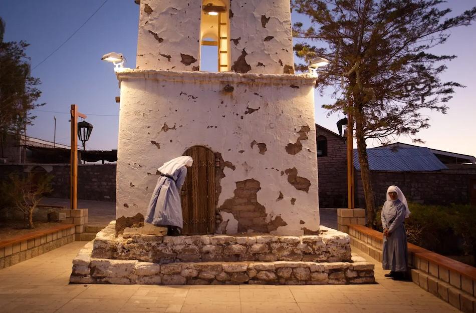 Thomas Allison photograph of nuns in front of a bell tower.