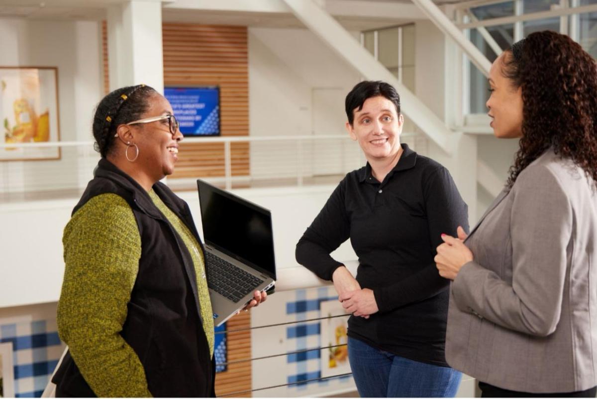 Three people talking to eat other 