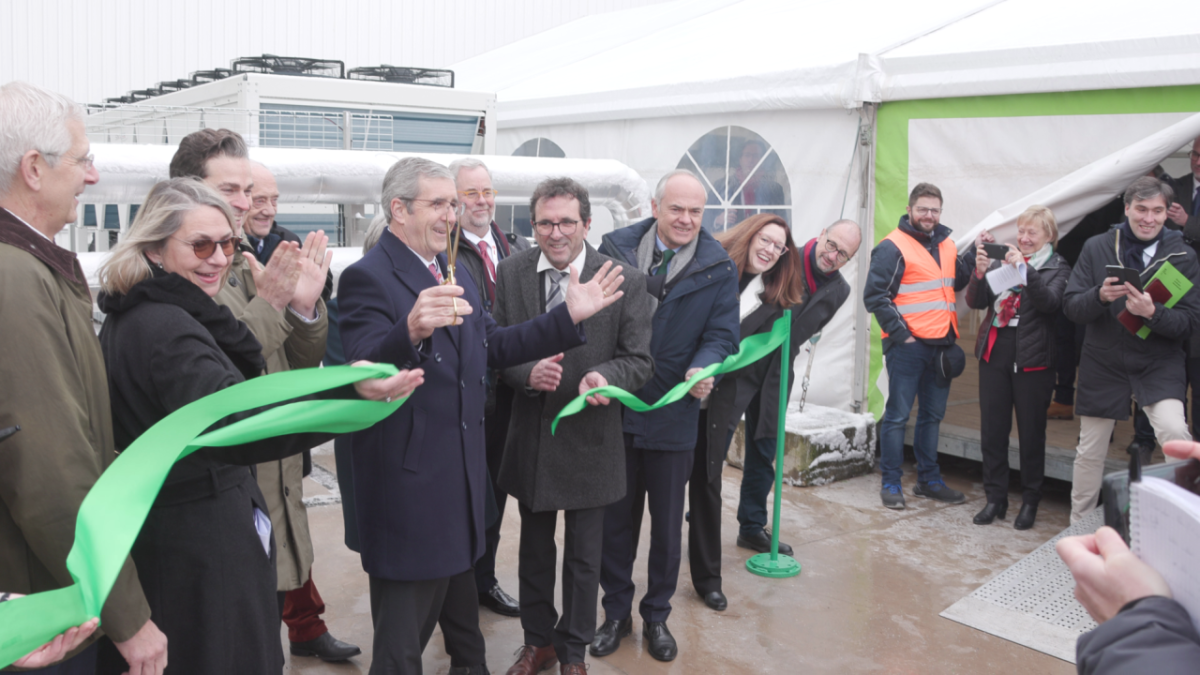 Dave Regnery, Chair and CEO, Trane Technologies, fifth from left, cuts the ribbon at the company's Trane® Charmes manufacturing facility to celebrate its newly installed Thermal Management System, which eliminates the need for fossil fuels to heat and cool the site. 