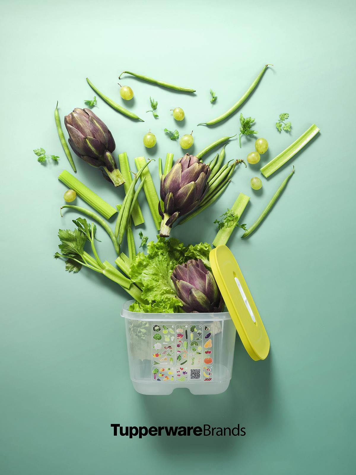 Fruits and vegetables emerging from Tupperware Brands container