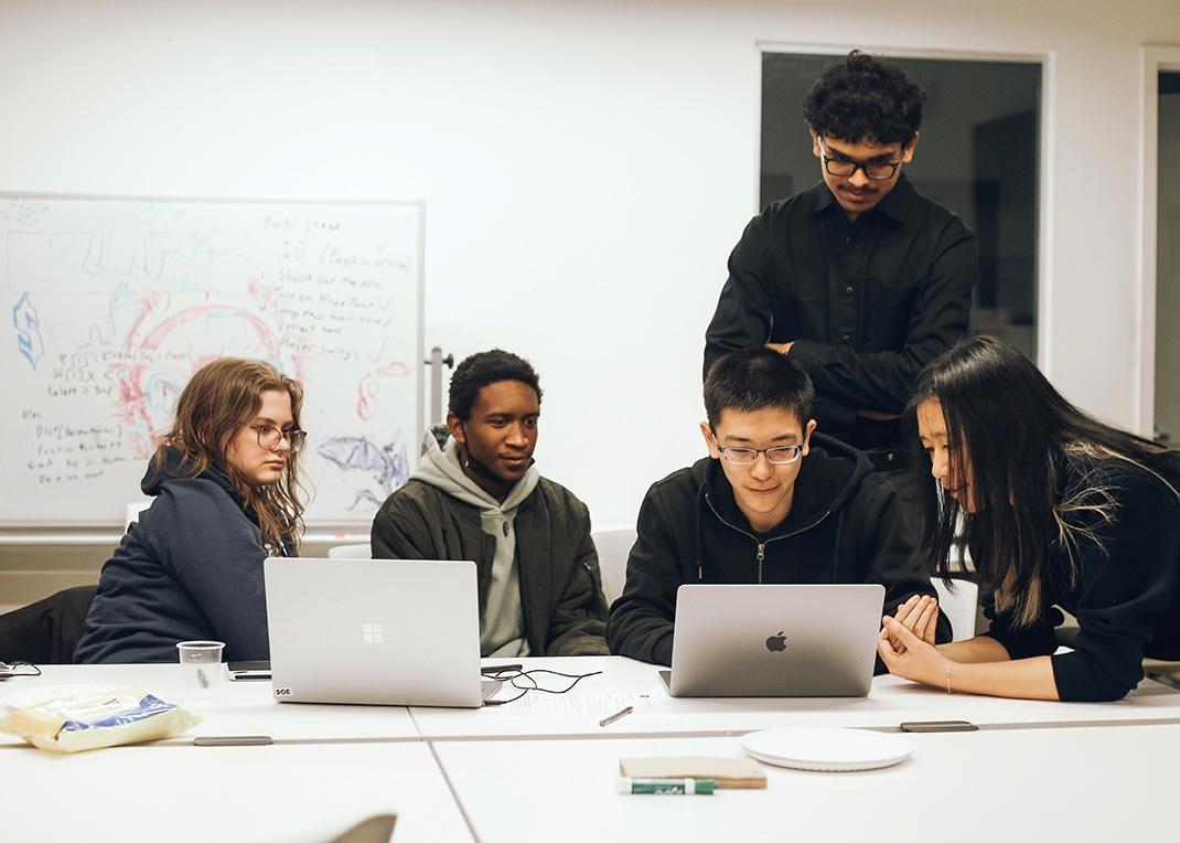 Mohammed, standing, is a recent alum and a new Teaching Assistant this Fall.