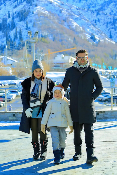 Vedant shown at a ski resort with his family.