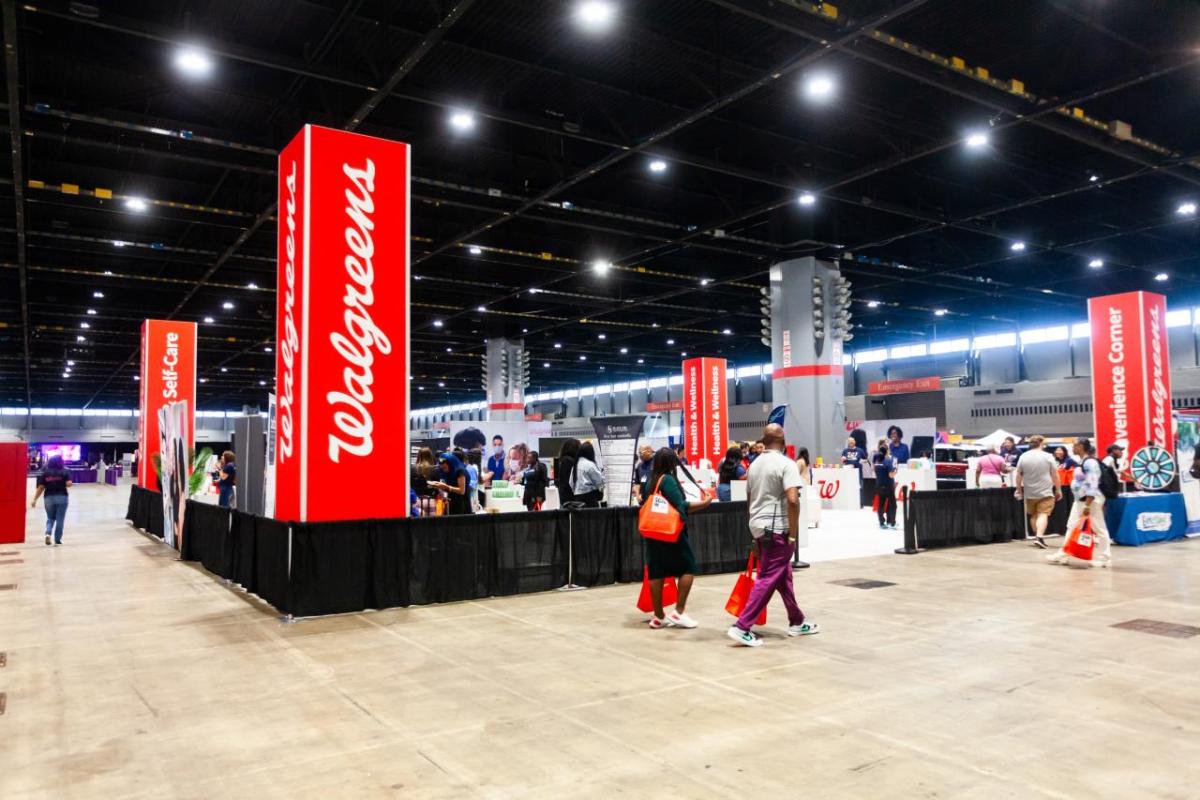 A large open expo center with people walking around