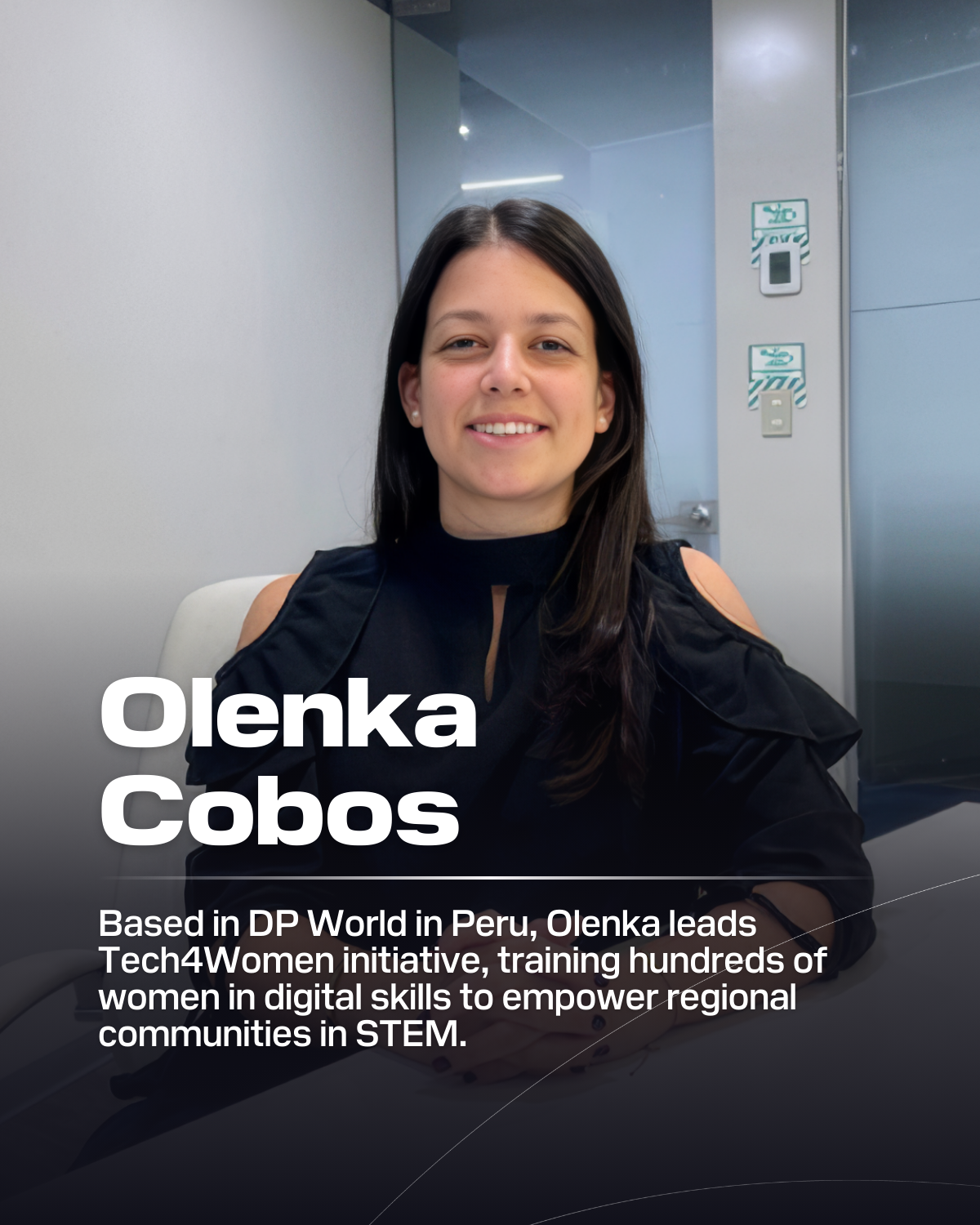 Olenka Cobos sitting at desk