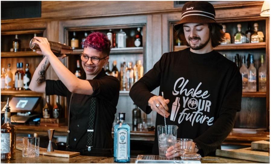 two bartenders practicing