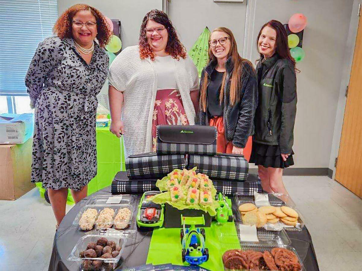 Employees with snacks and RC car