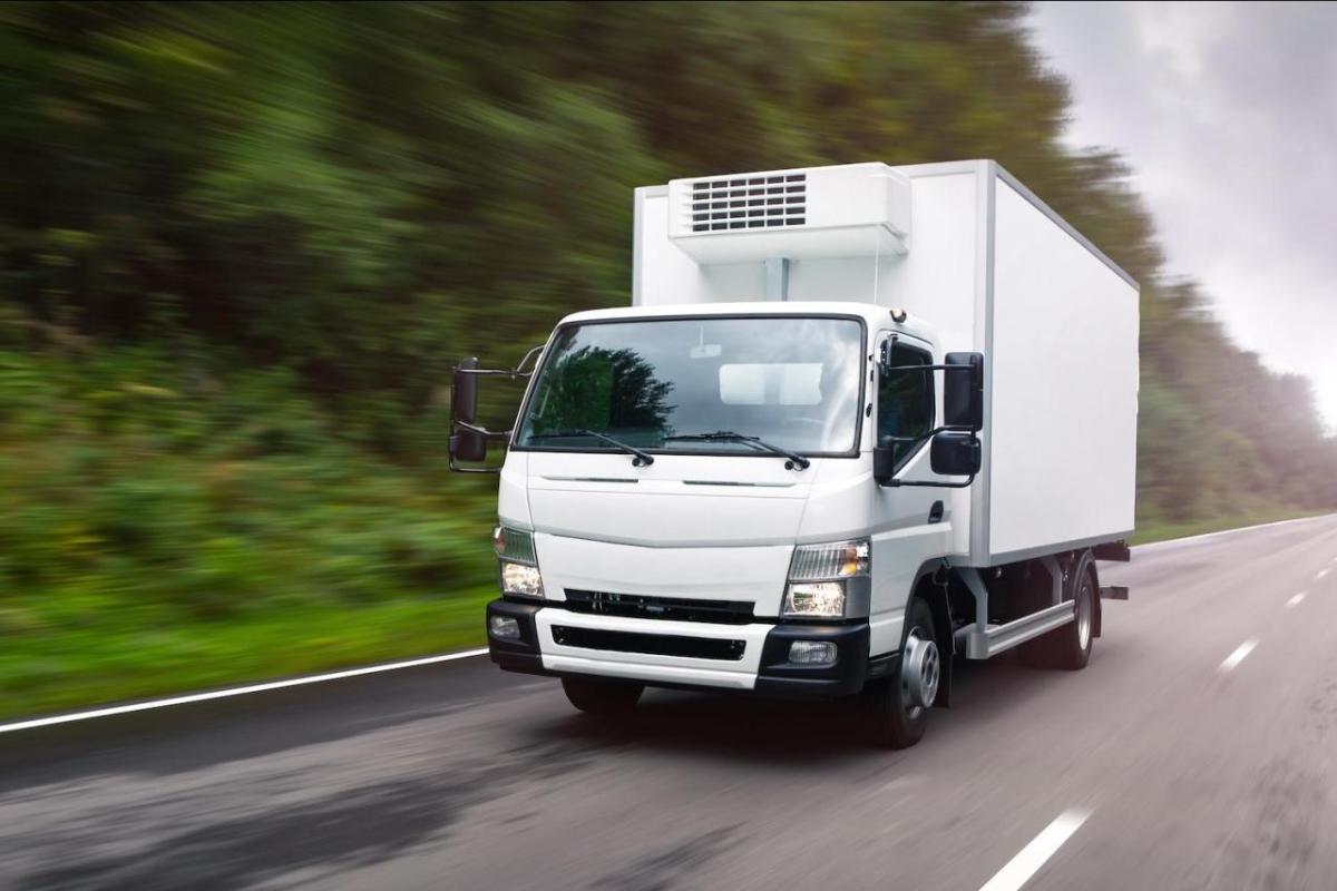 A large vehicle driving down the road