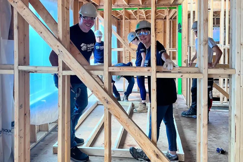 Volunteers inside a home being built.