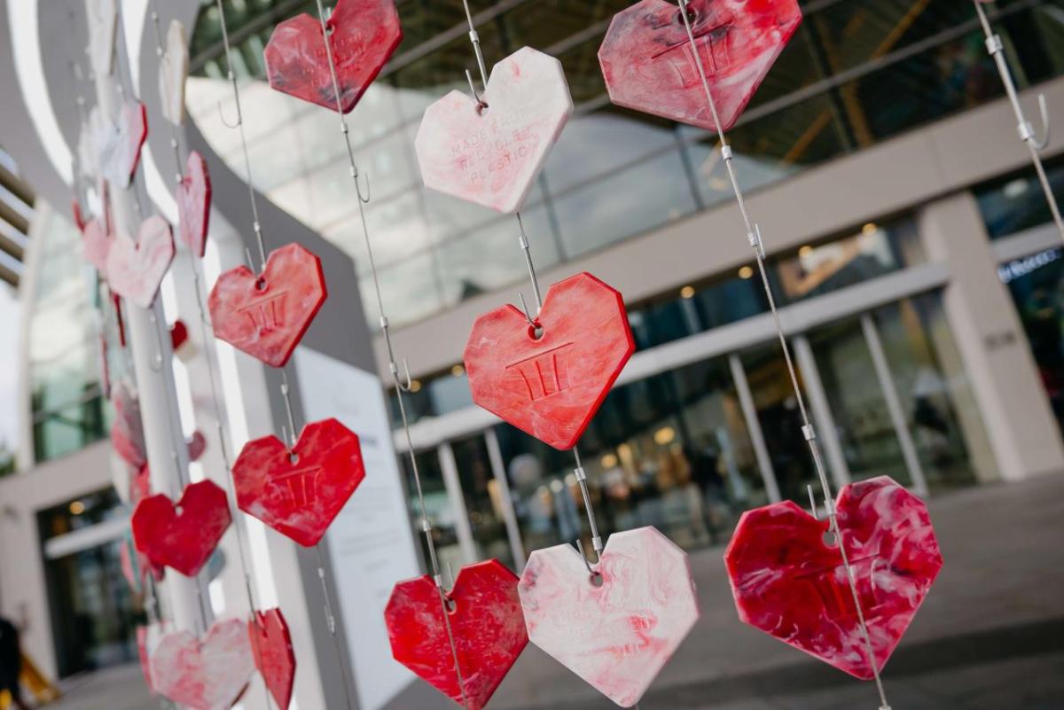 Hearts hanging on a grid outside a building