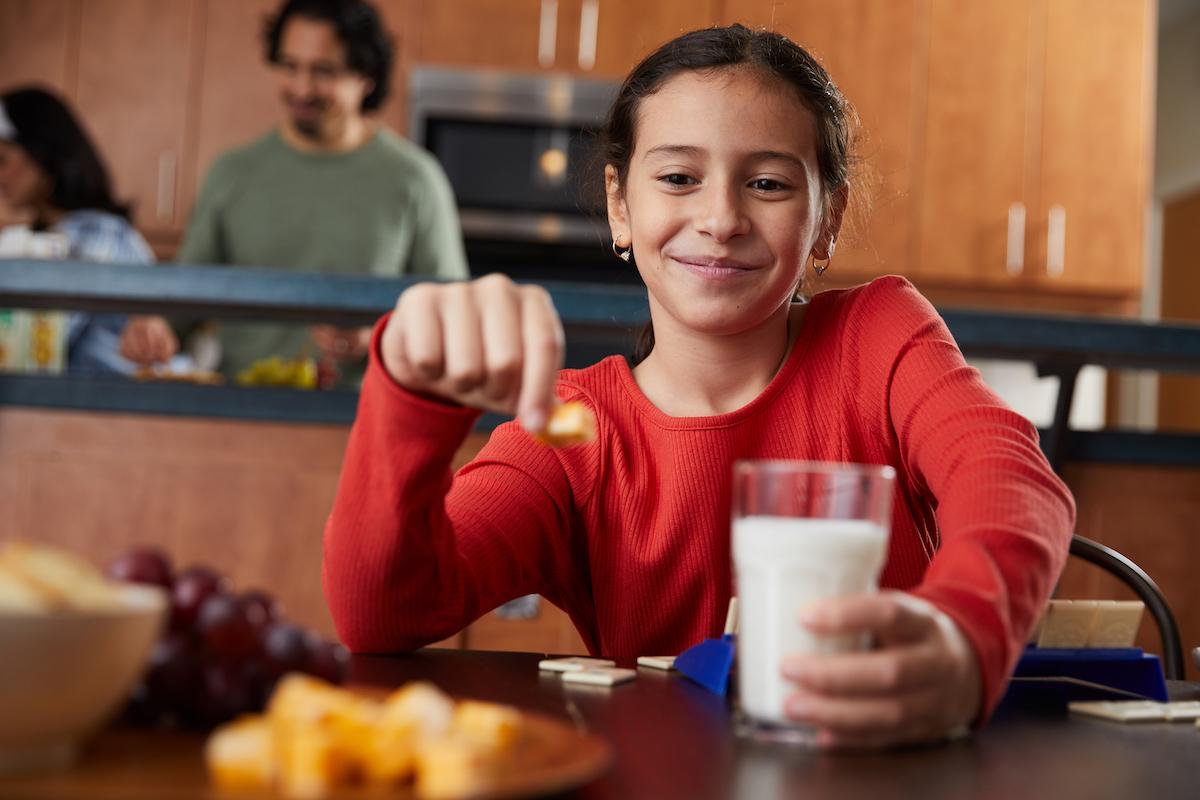 child with glass of milk