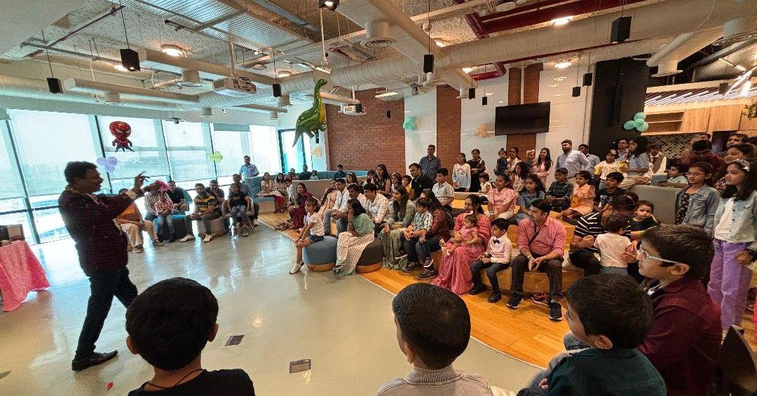 Employees and their children watching a presenter