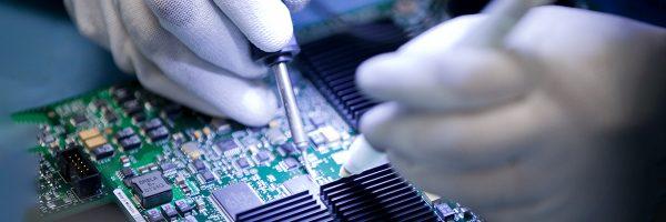 person working on circuit board