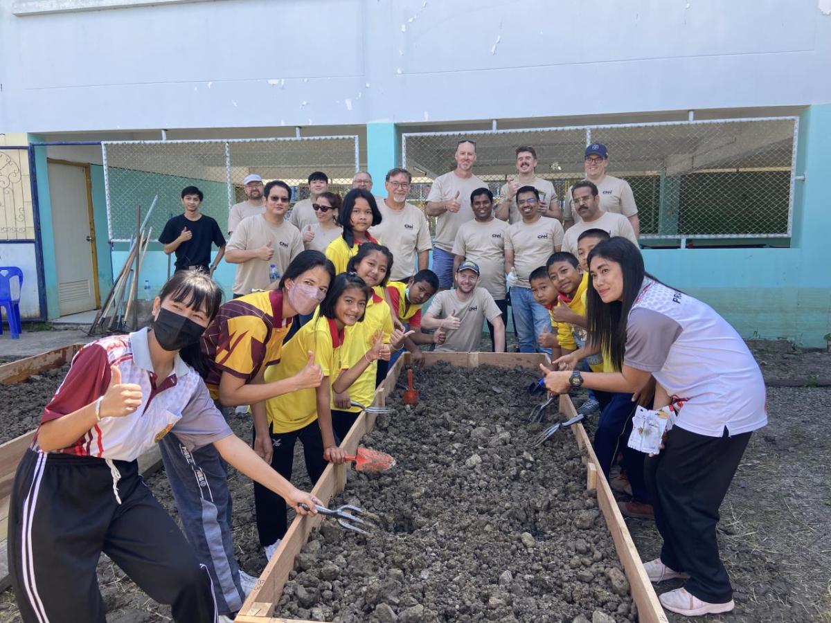 volunteers help build a garden