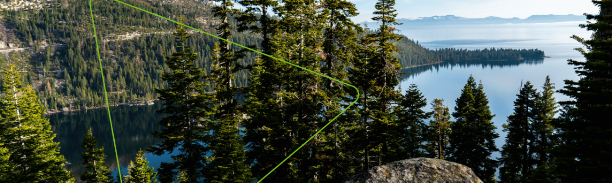 Panoramic view of a forested, hilly coastline.