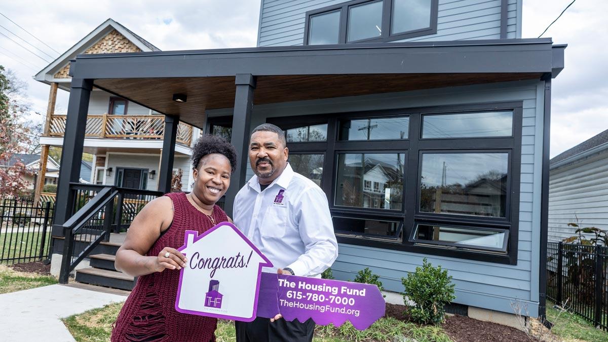 The Housing Fund President and CEO Marshall Crawford congratulates a first-time homebuyer in South Nashville.