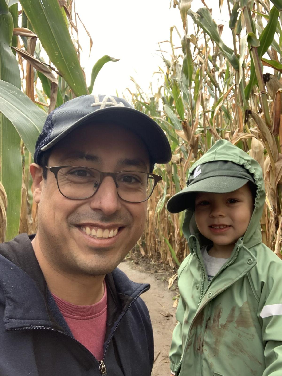 Matthew Sanchez and a child in a corn maze