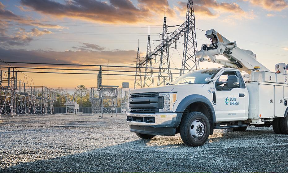 a duke energy truck with powerlines behind it