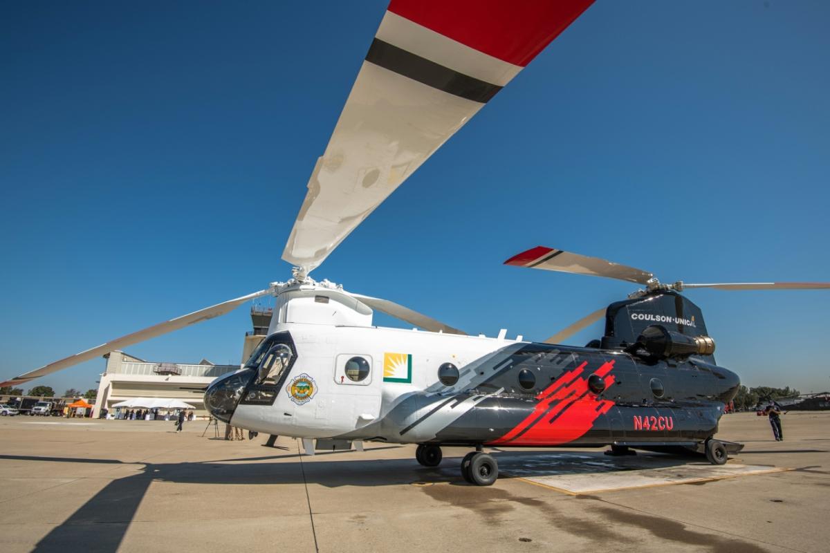 A helicopter and heli-tanker on the ground