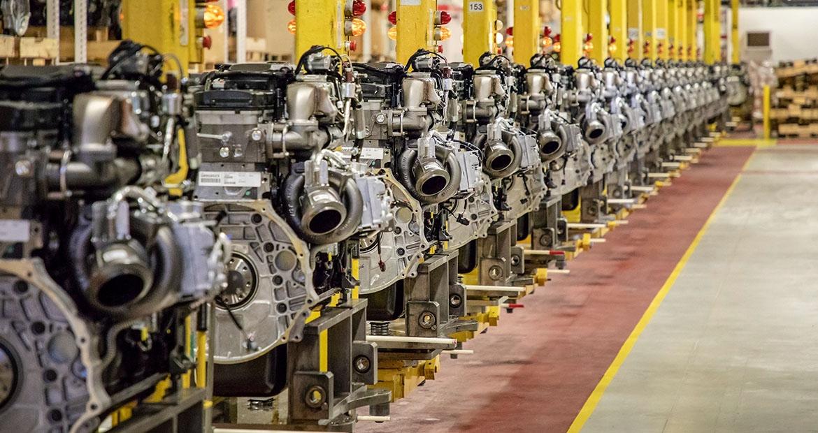 A neat row of Engines in a manufacturing setting.