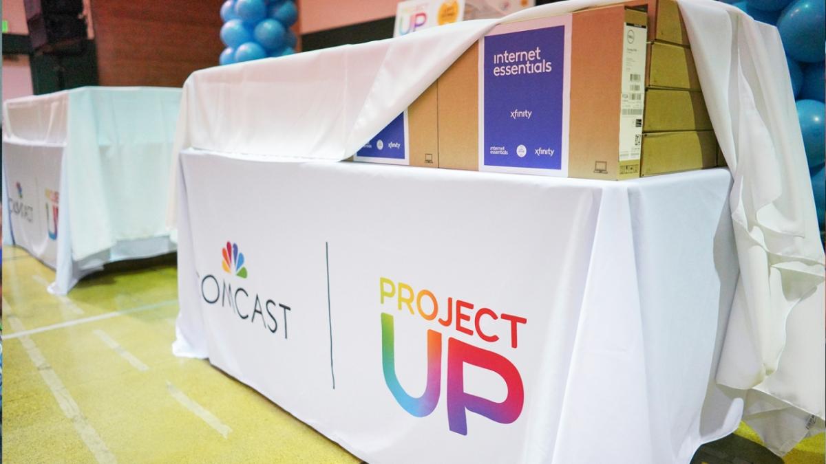 Internet Essentials laptops on a Project UP table display at Astronaut José M. Hernandez Academy.