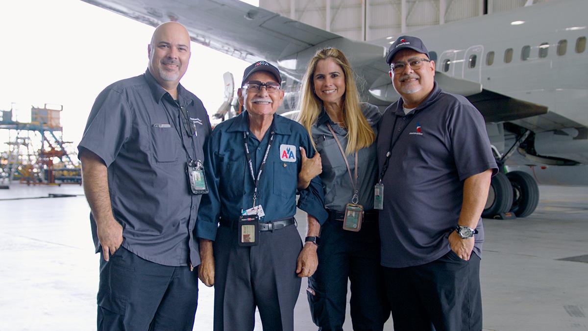 Luis Rodriguez-Sepulveda and three family members pose in front of an airplane.