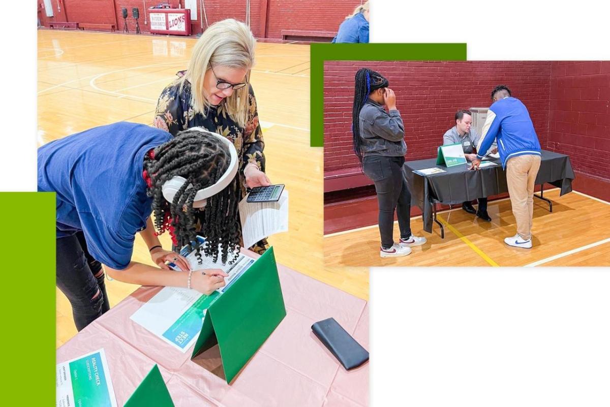 Volunteers assisting youth filling out worksheets.