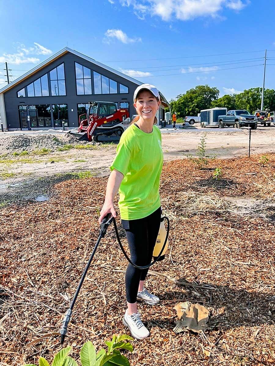 A person spraying plants 