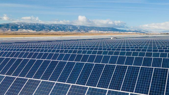 A vast open area filled with rows of solar panels.