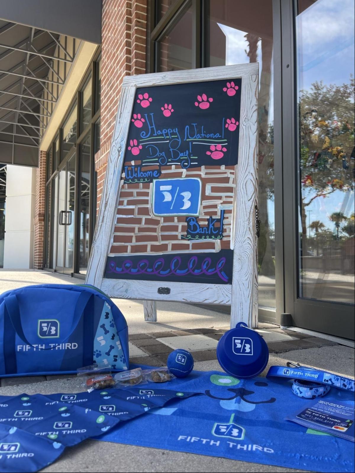 A sign saying "Happy National Dog Day!"