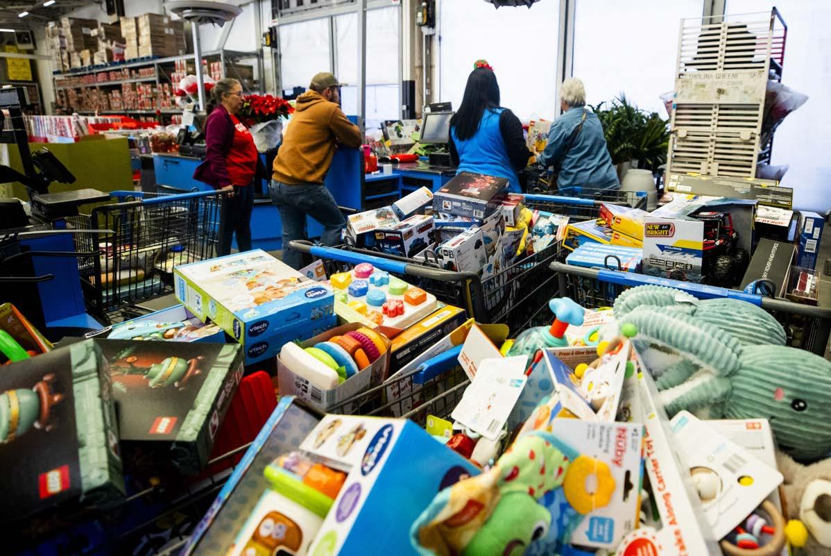 Carts full of toys in a warehouse setting.