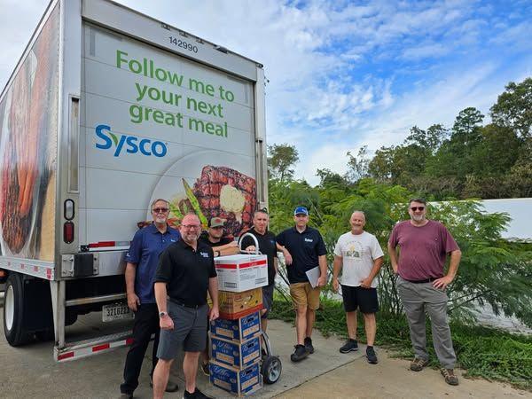 group photo in front of Sysco truck