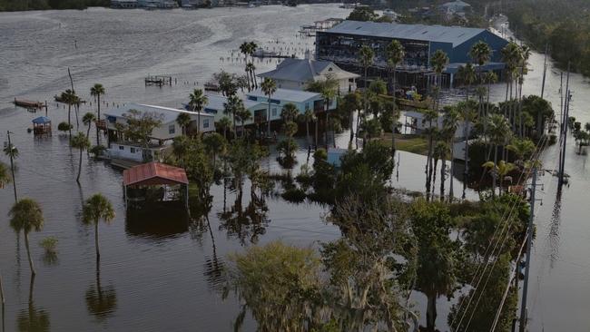 Aerial view of buildings and trees under high water.